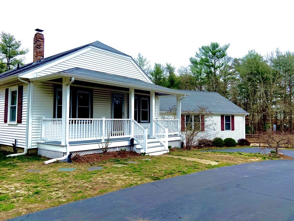 48 Pine Street Rochester, MA 02770 - Photo 2 of 39 a front view of a house with a yard