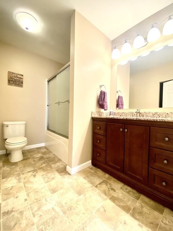 48 Pine Street Rochester, MA 02770 - Photo 28 of 39 a spacious bathroom with a granite countertop sink and a toilet