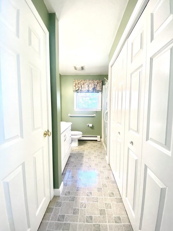 48 Pine Street Rochester, MA 02770 - Photo 38 of 39 a view of a hallway with wooden floor and a bathroom