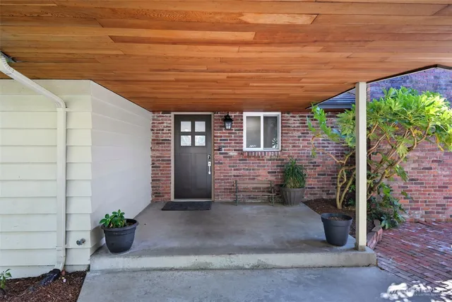 a view of a terrace with chair and potted plants