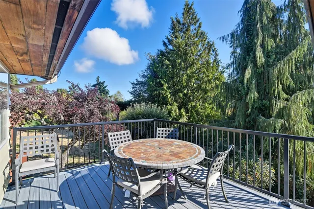 a view from deck having patio