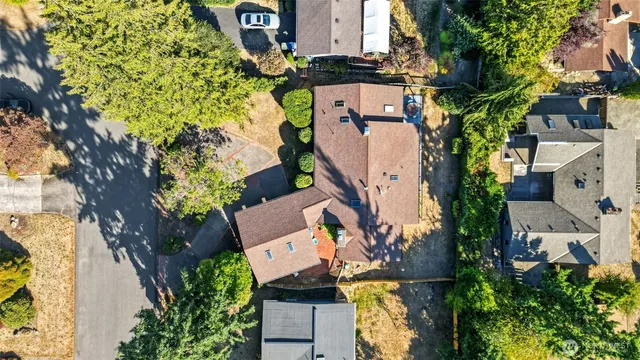 an aerial view of a house with outdoor space and street view