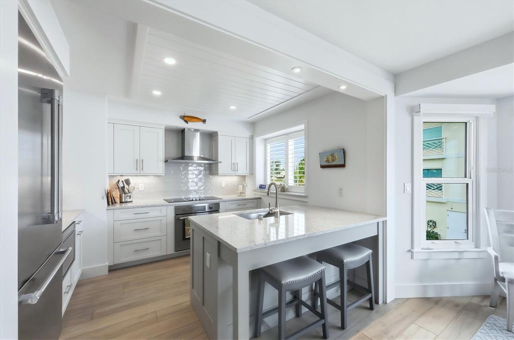 11000 Placida Road, Unit 2501 Placida, FL 33946 - Photo 13 of 56 a kitchen with a sink stove and refrigerator