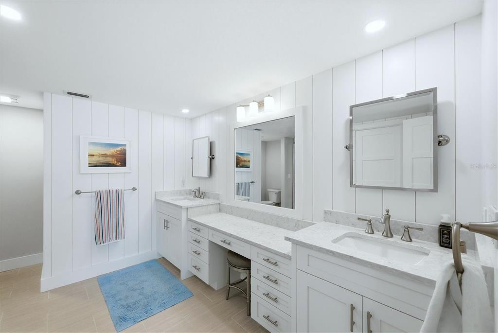 11000 Placida Road, Unit 2501 Placida, FL 33946 - Photo 19 of 56 a bathroom with a granite countertop sink mirror and double