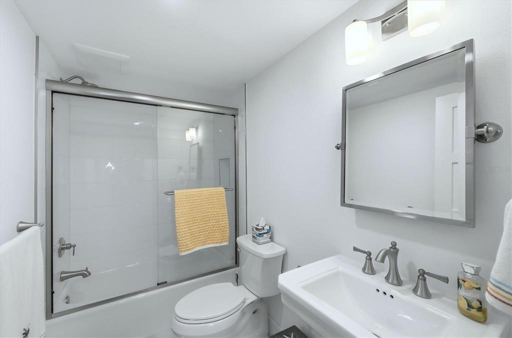 11000 Placida Road, Unit 2501 Placida, FL 33946 - Photo 23 of 56 a bathroom with a sink toilet and shower