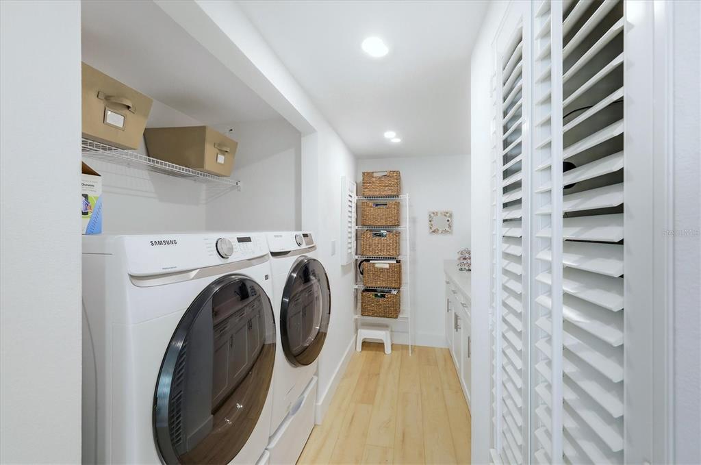 11000 Placida Road, Unit 2501 Placida, FL 33946 - Photo 26 of 56 a view of a bedroom with washer and dryer