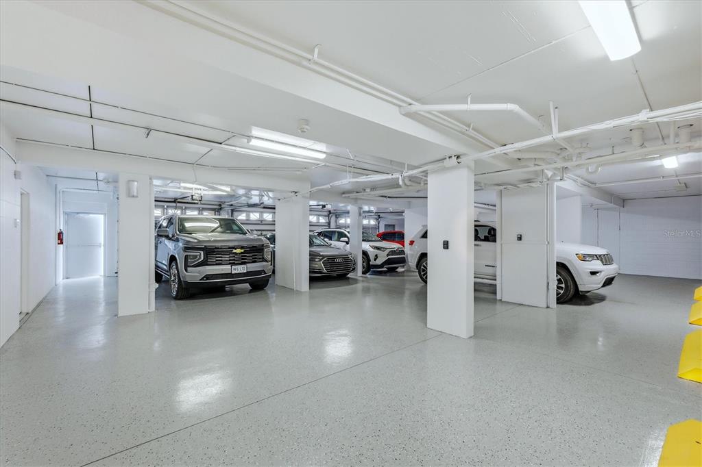 11000 Placida Road, Unit 2501 Placida, FL 33946 - Photo 27 of 56 a view of a garage with parked cars