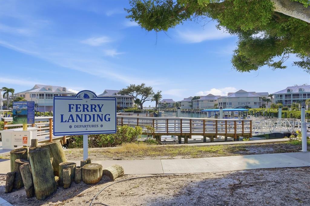 11000 Placida Road, Unit 2501 Placida, FL 33946 - Photo 42 of 56 a view of a street with benches and buildings in the background