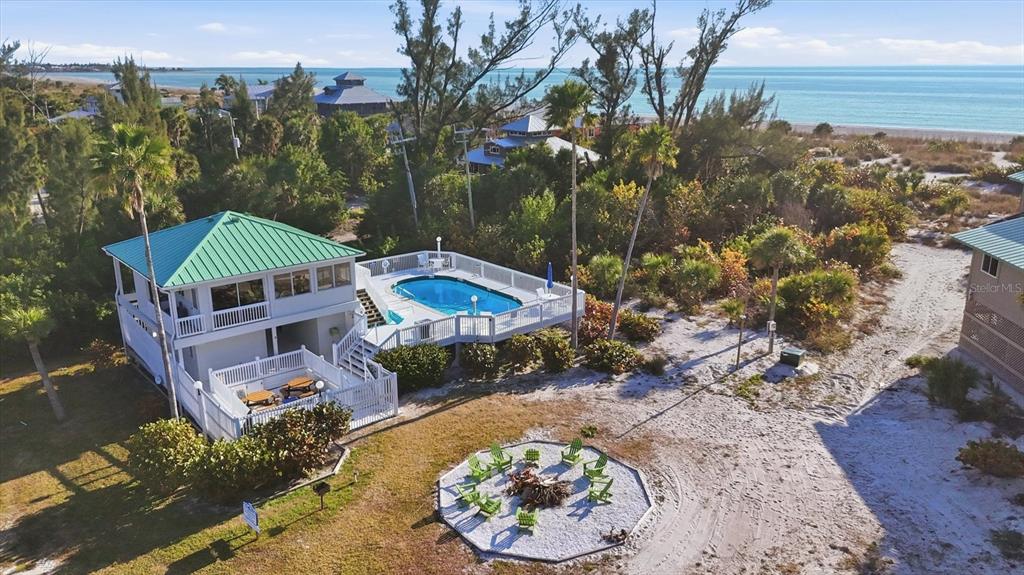 11000 Placida Road, Unit 2501 Placida, FL 33946 - Photo 45 of 56 an aerial view of a house with a garden and lake view