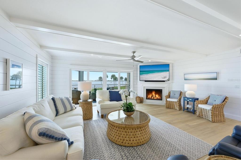 11000 Placida Road, Unit 2501 Placida, FL 33946 - Photo 5 of 56 a living room with furniture and a fireplace