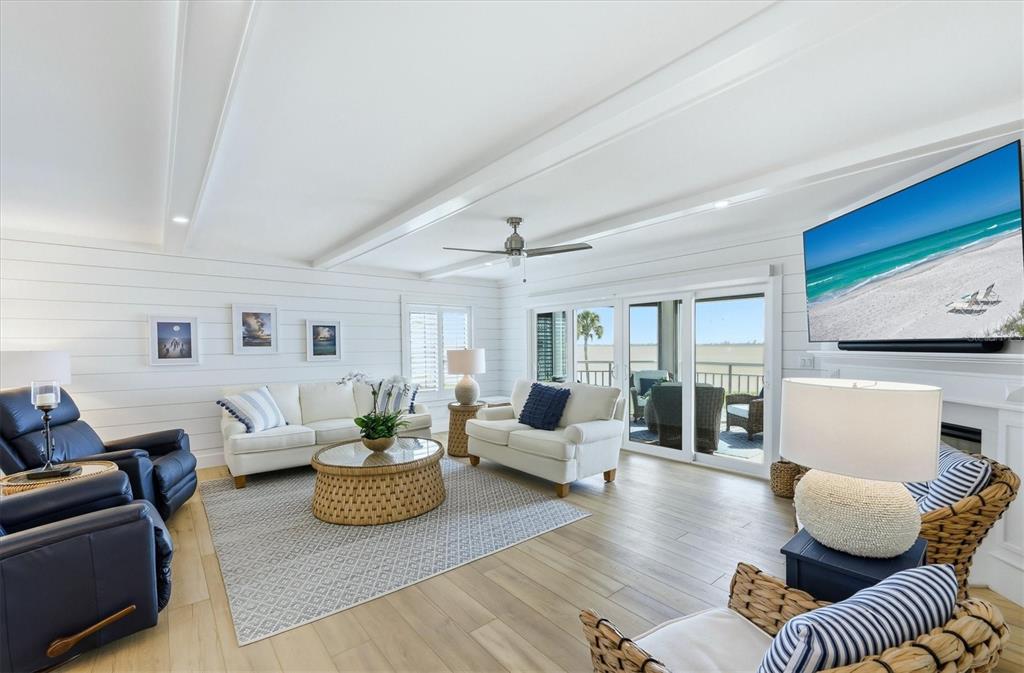 11000 Placida Road, Unit 2501 Placida, FL 33946 - Photo 6 of 56 a living room with furniture or couch and a large window