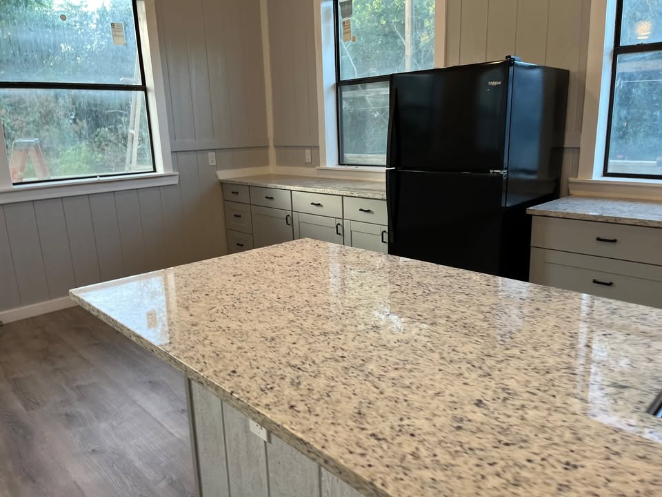 3505 Lone Man Mountain Road, Unit A Wimberley, TX 78676 - Photo 6 of 11 A well-appointed kitchen showcasing elegant granite counters and durable vinyl flooring.