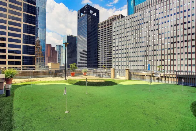 a front view of a building with a yard