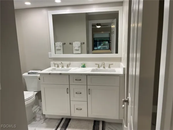 a bedroom with bed and a night stand