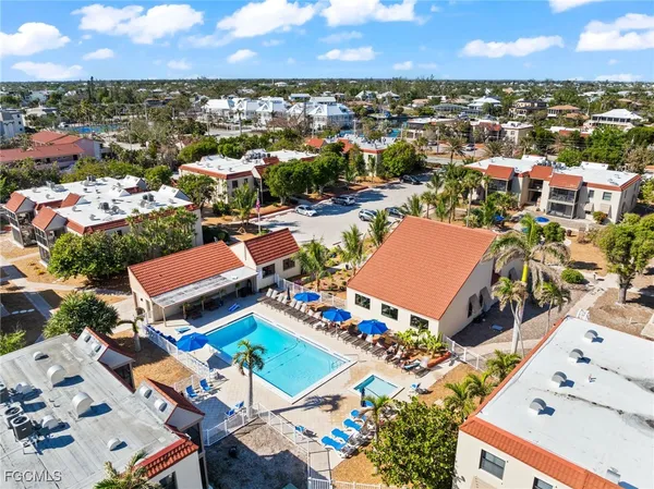 a sign that is sitting in front of flowers
