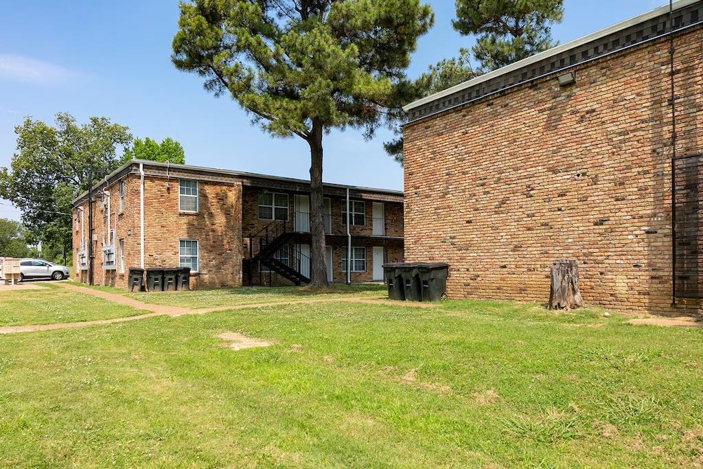 3236 Millington Road Memphis, TN 38127 - Photo 6 of 31 Brick exterior apartment building featuring multiple units
