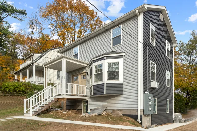 a front view of a house with street