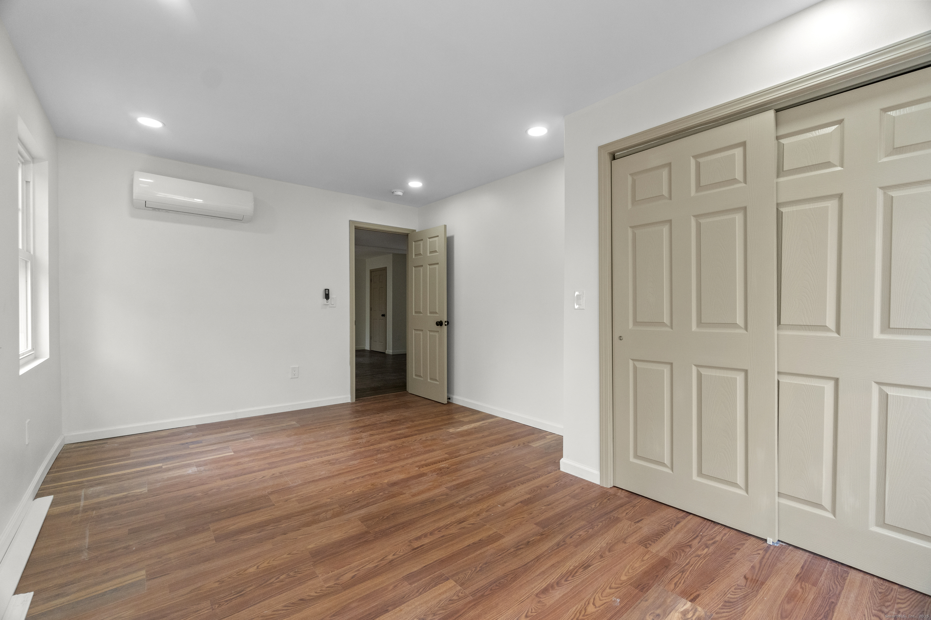 1285 Townsend Avenue, Unit 1 New Haven, CT 06513 - Photo 17 of 17 a view of an empty room with wooden floor