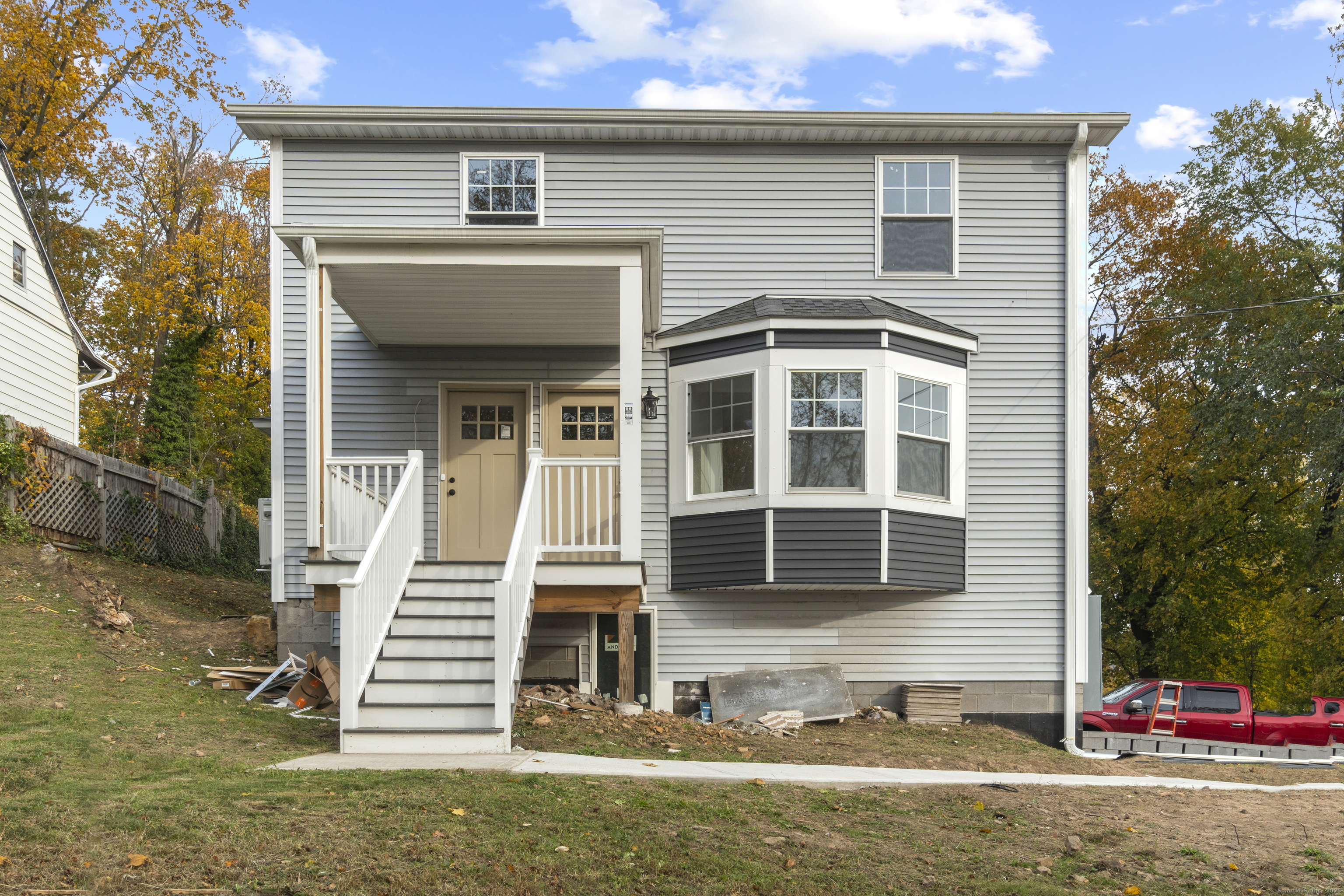 1285 Townsend Avenue, Unit 1 New Haven, CT 06513 - Photo 2 of 17 a front view of a house with a yard and garage