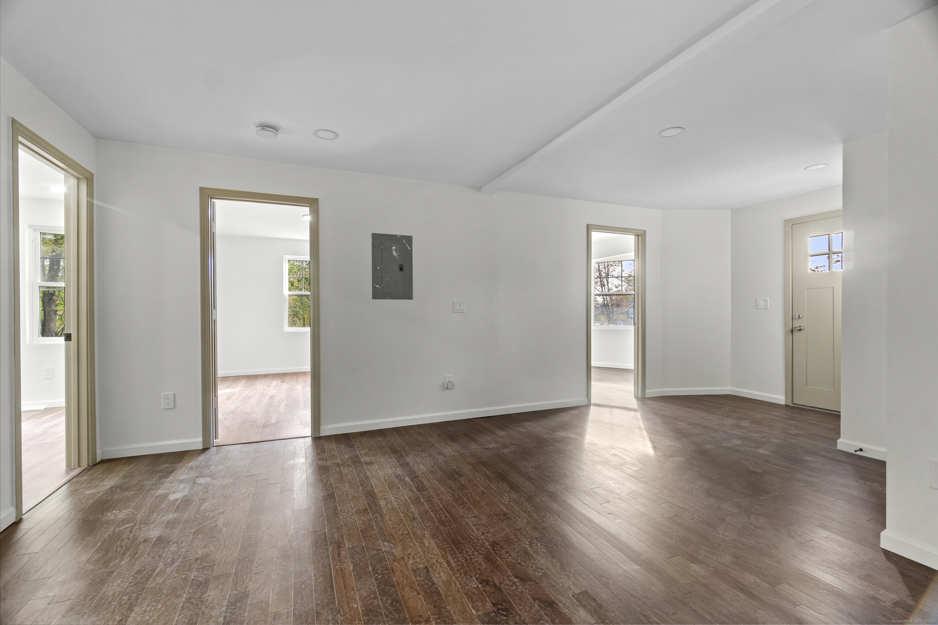 1285 Townsend Avenue, Unit 1 New Haven, CT 06513 - Photo 5 of 17 an empty room with wooden floor and windows