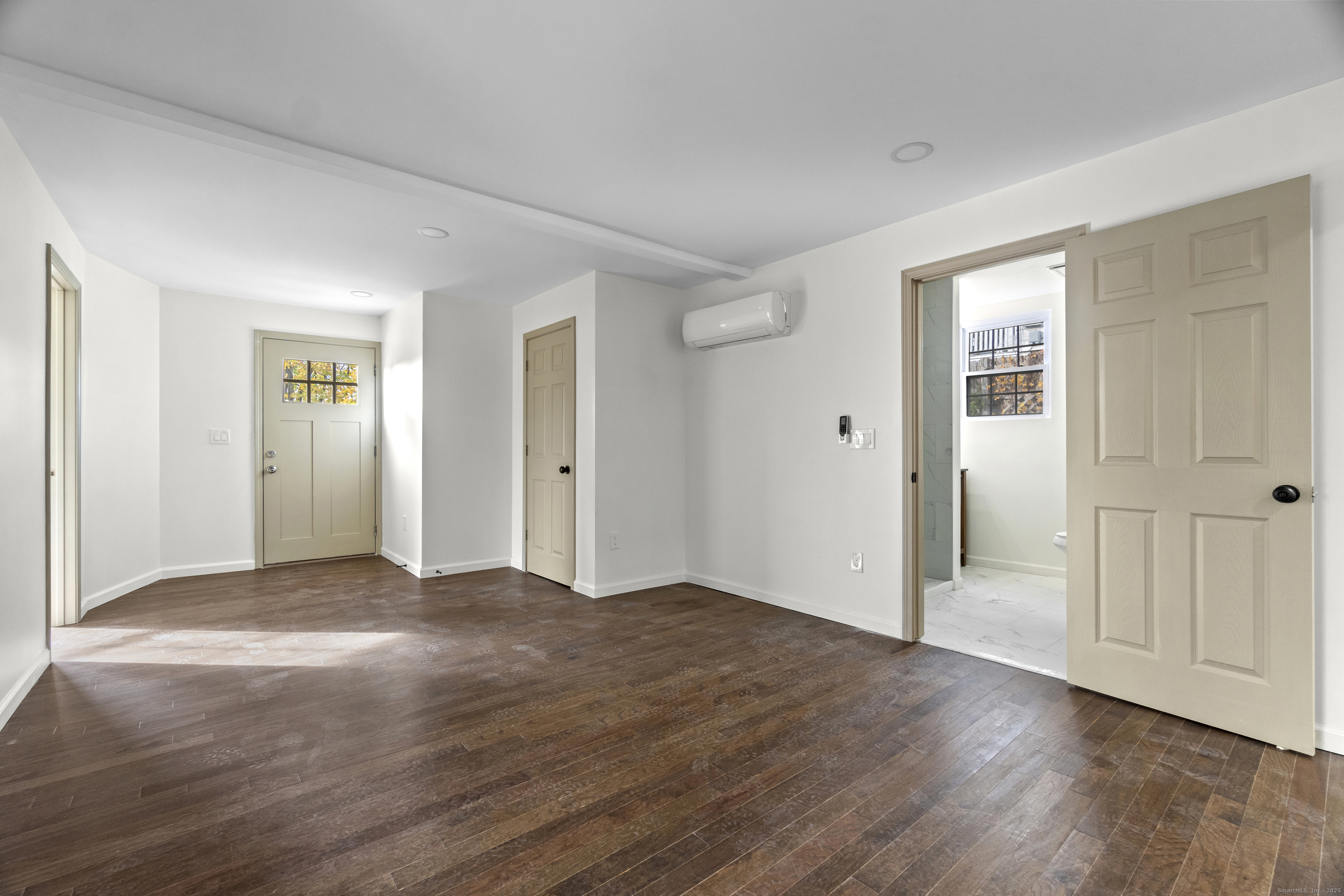 1285 Townsend Avenue, Unit 1 New Haven, CT 06513 - Photo 7 of 17 an empty room with wooden floor & windows and closet