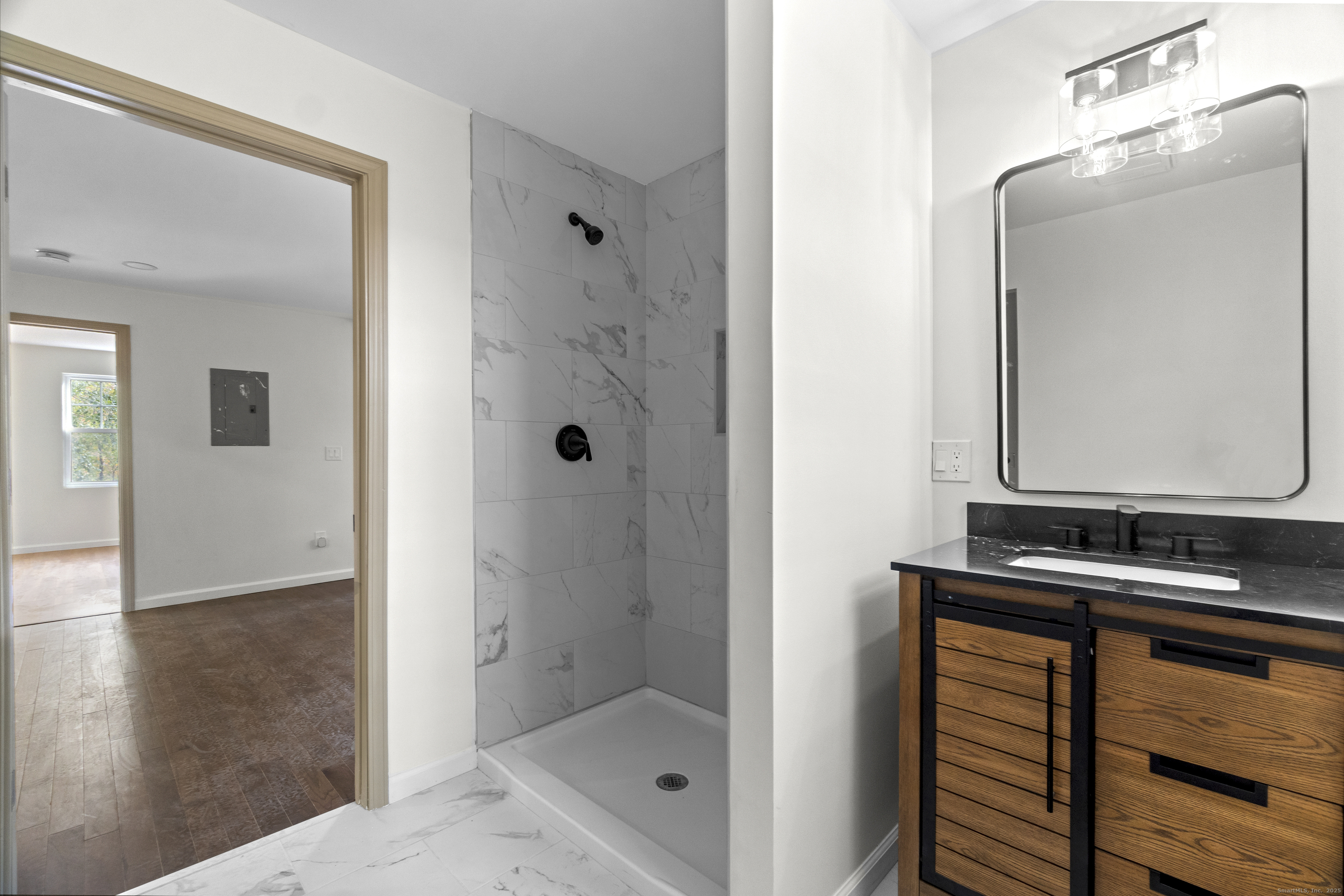 1285 Townsend Avenue, Unit 1 New Haven, CT 06513 - Photo 9 of 17 a bathroom with a shower sink and mirror