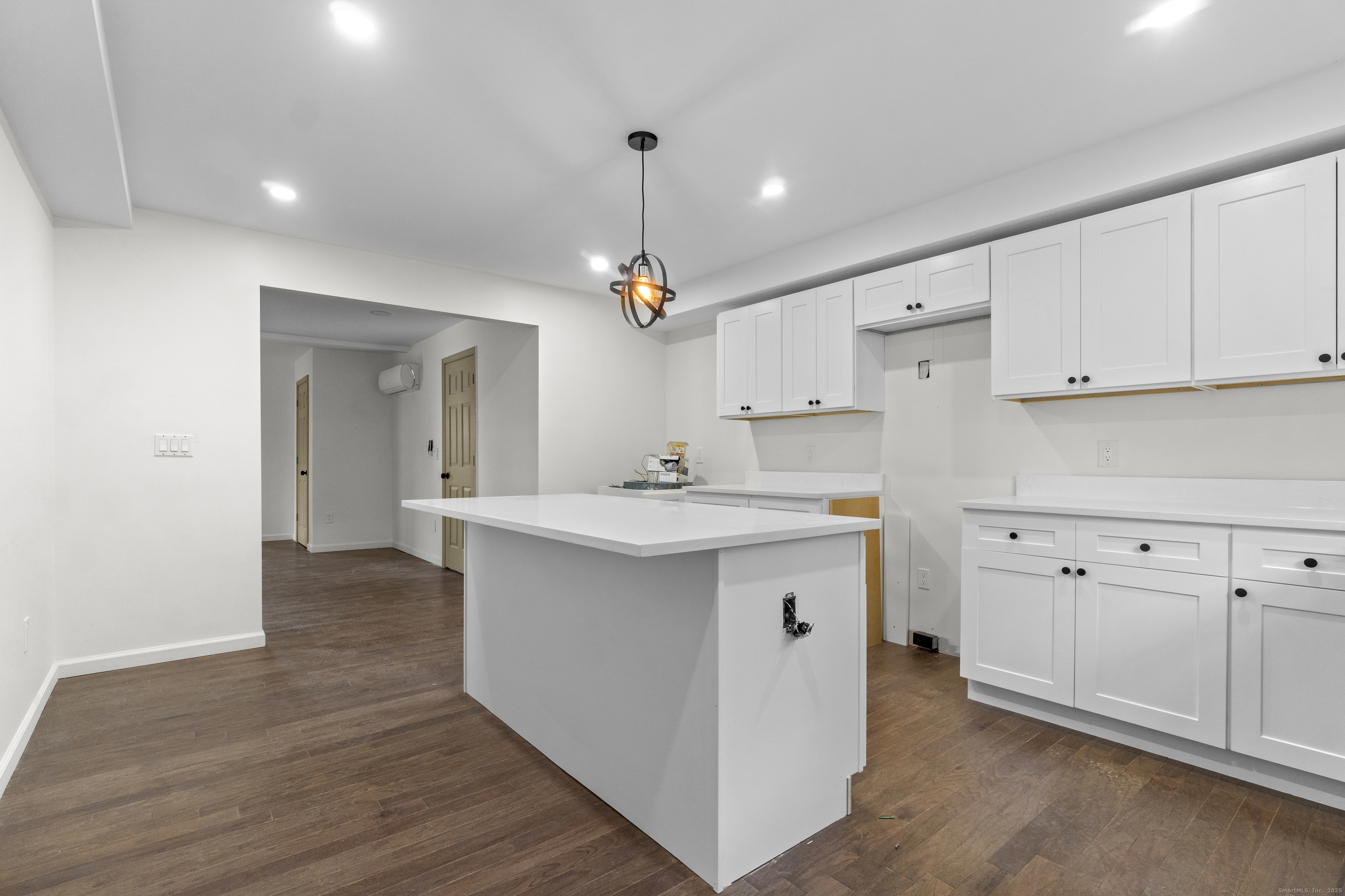 1285 Townsend Avenue, Unit 1 New Haven, CT 06513 - Photo 10 of 17 a kitchen with a sink cabinets and wooden floor