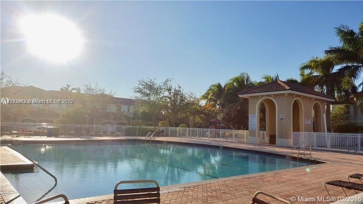 14055 Southwest 49th Street, Unit 6 Miramar, FL 33027 - Photo 11 of 12 a view of a lake in front of house