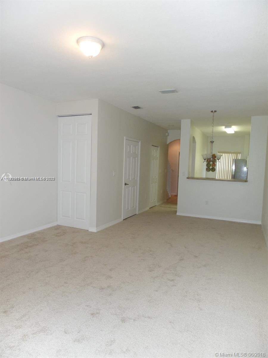 14055 Southwest 49th Street, Unit 6 Miramar, FL 33027 - Photo 4 of 12 an empty room with a bathroom