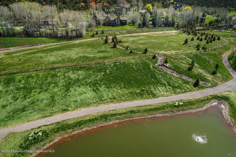 182 Hoaglund Ranch Road Basalt, CO 81621 - Photo 16 of 31 a view of a golf course with a lake