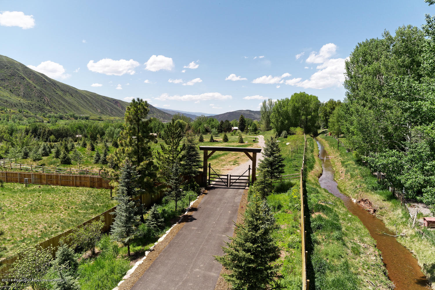 182 Hoaglund Ranch Road Basalt, CO 81621 - Photo 9 of 31 a view of a city with lush green forest