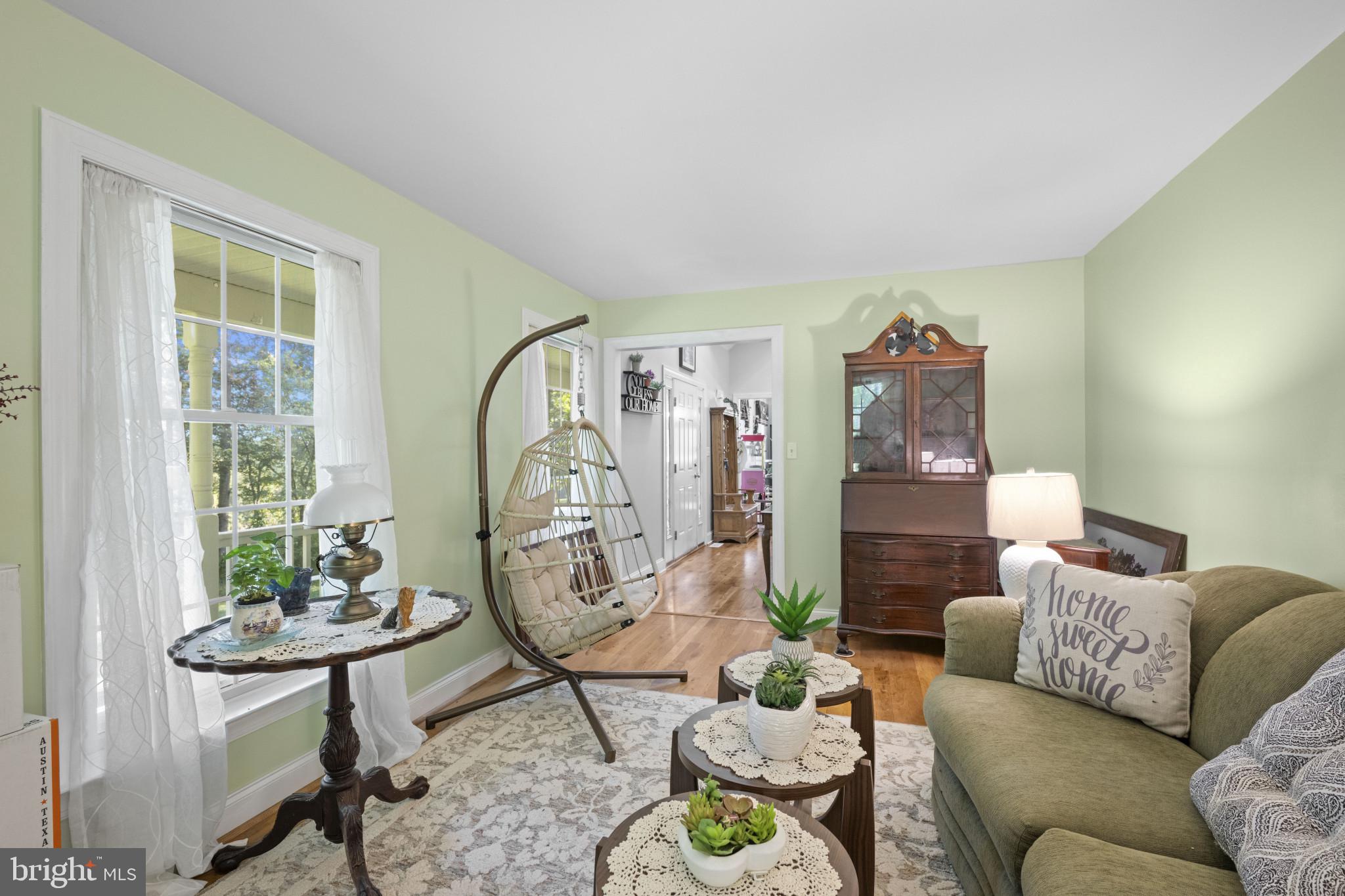 194 Cook Road Delta, PA 17314 - Photo 20 of 35 a living room with furniture a table and a window