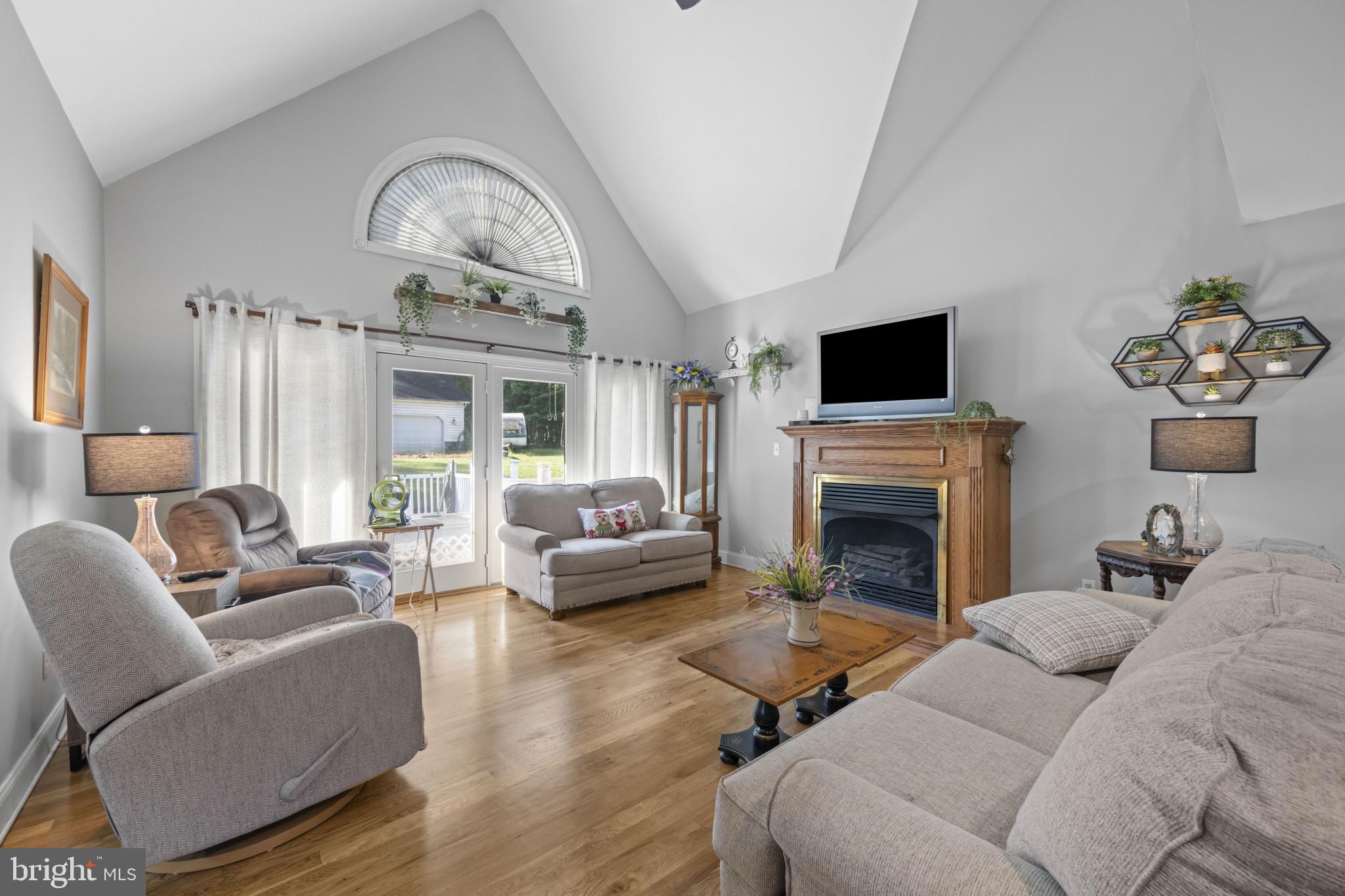 194 Cook Road Delta, PA 17314 - Photo 2 of 35 a living room with furniture fireplace and a large window