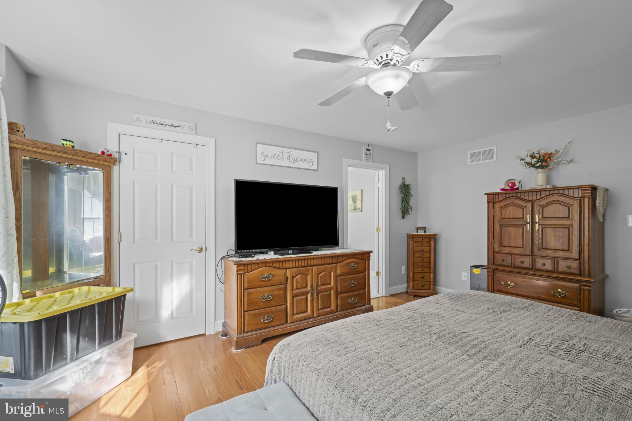 194 Cook Road Delta, PA 17314 - Photo 23 of 35 a bedroom with furniture and a flat screen tv