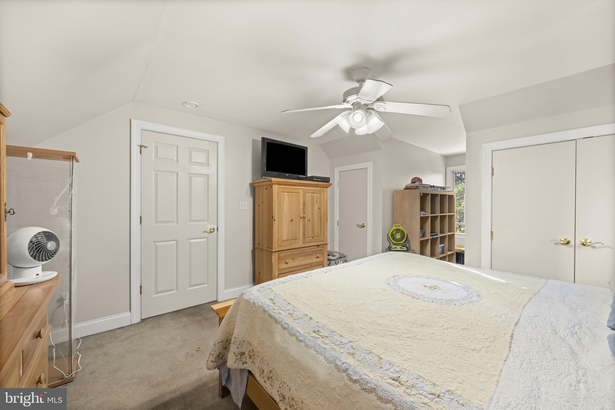 194 Cook Road Delta, PA 17314 - Photo 31 of 35 a bedroom with a bed and a chandelier