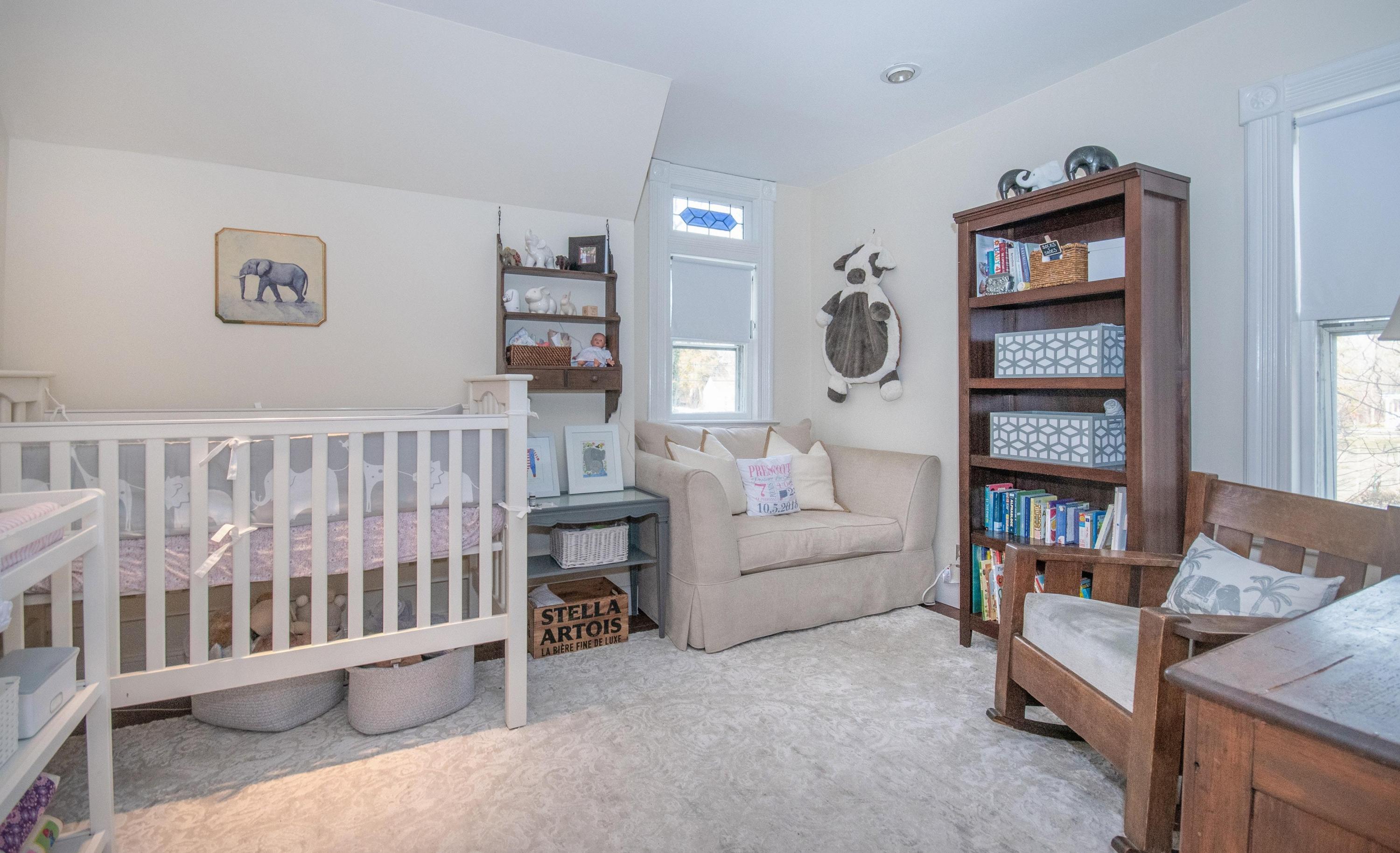 338 Flax Hill Road Norwalk, CT 06854 - Photo 17 of 26 a living room with furniture and baby crib