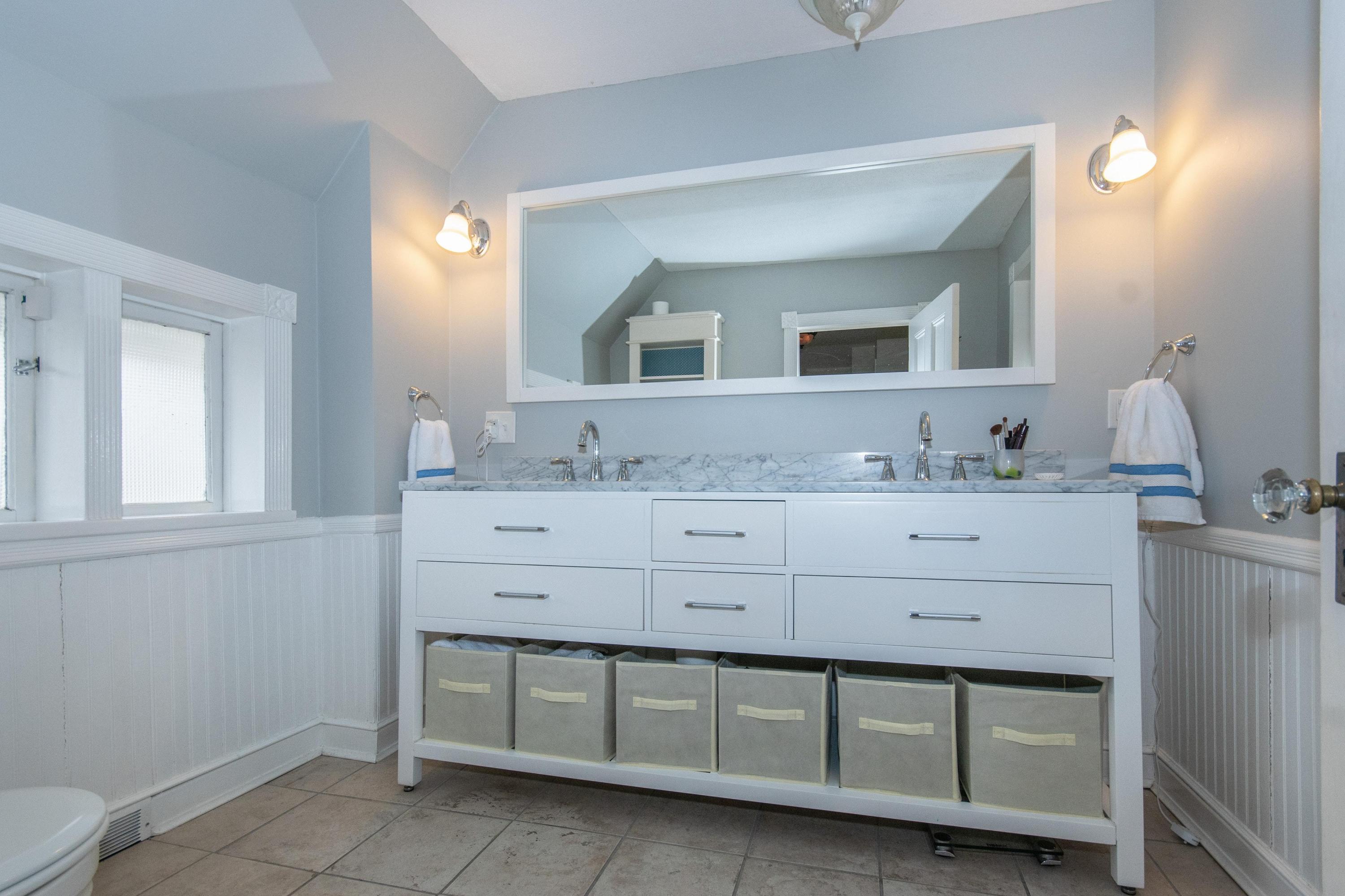 338 Flax Hill Road Norwalk, CT 06854 - Photo 19 of 26 a bathroom with a sink vanity and mirror