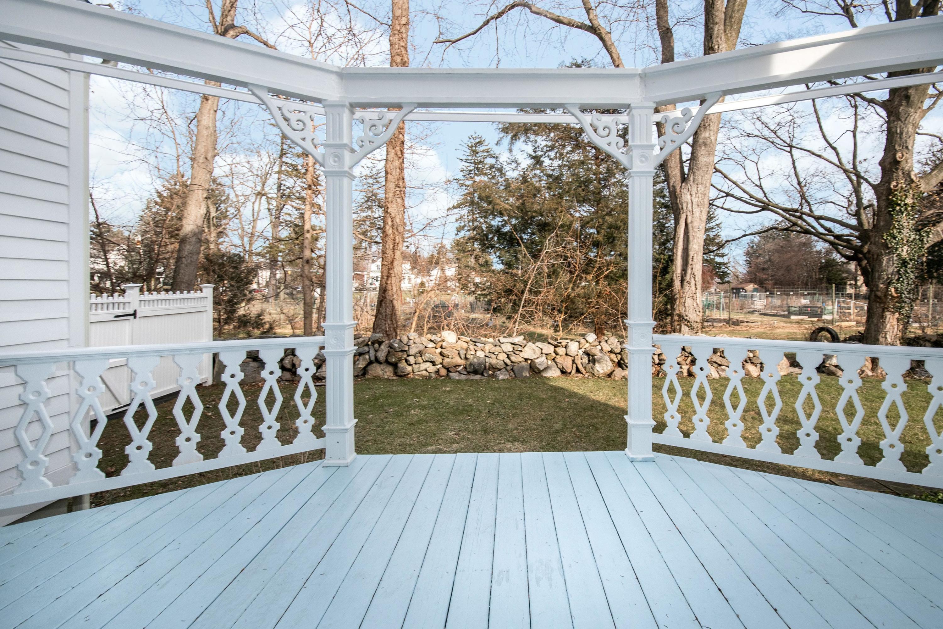 338 Flax Hill Road Norwalk, CT 06854 - Photo 20 of 26 a front view of a house with wooden floor and outdoor space