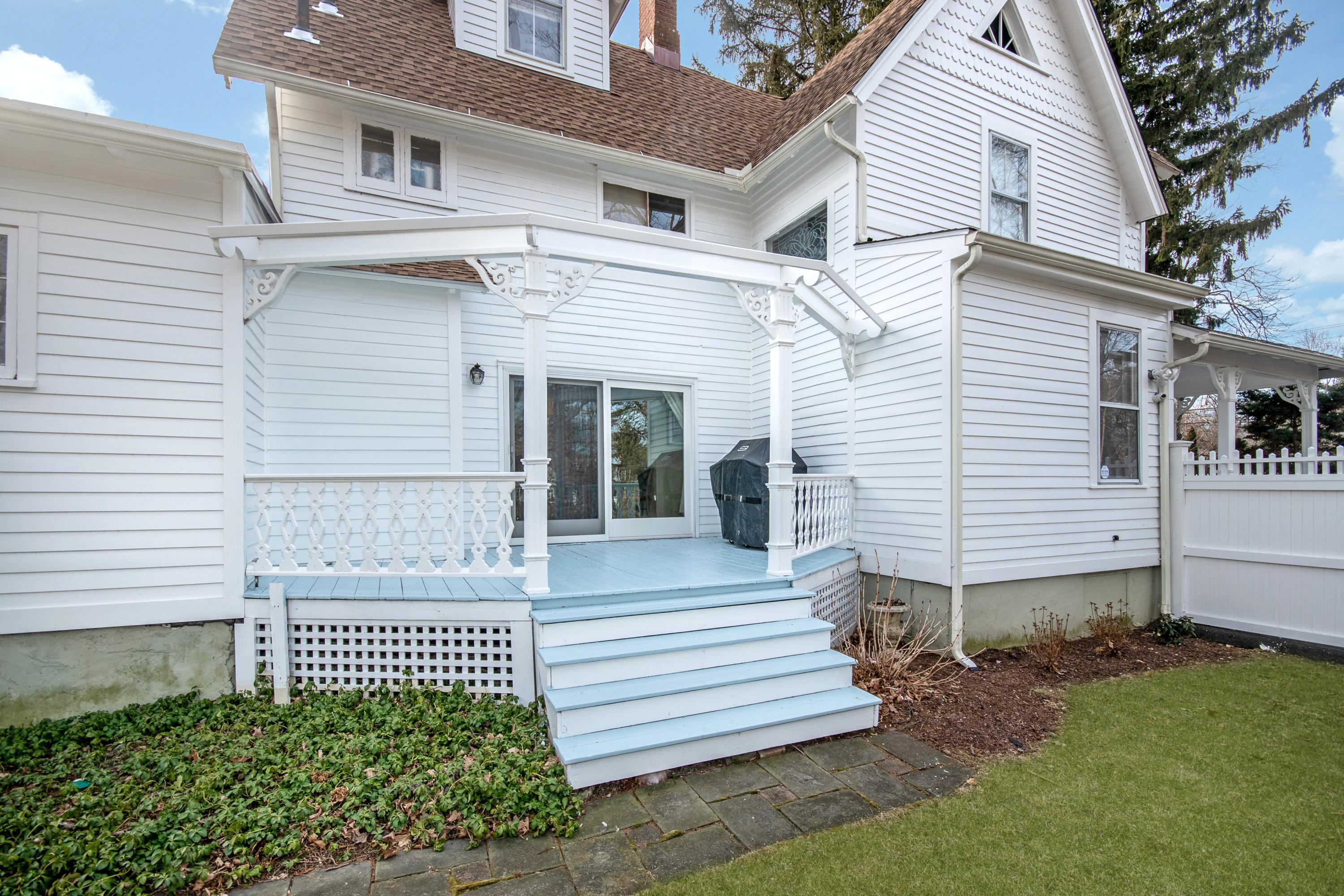 338 Flax Hill Road Norwalk, CT 06854 - Photo 21 of 26 a front view of a house with a garden