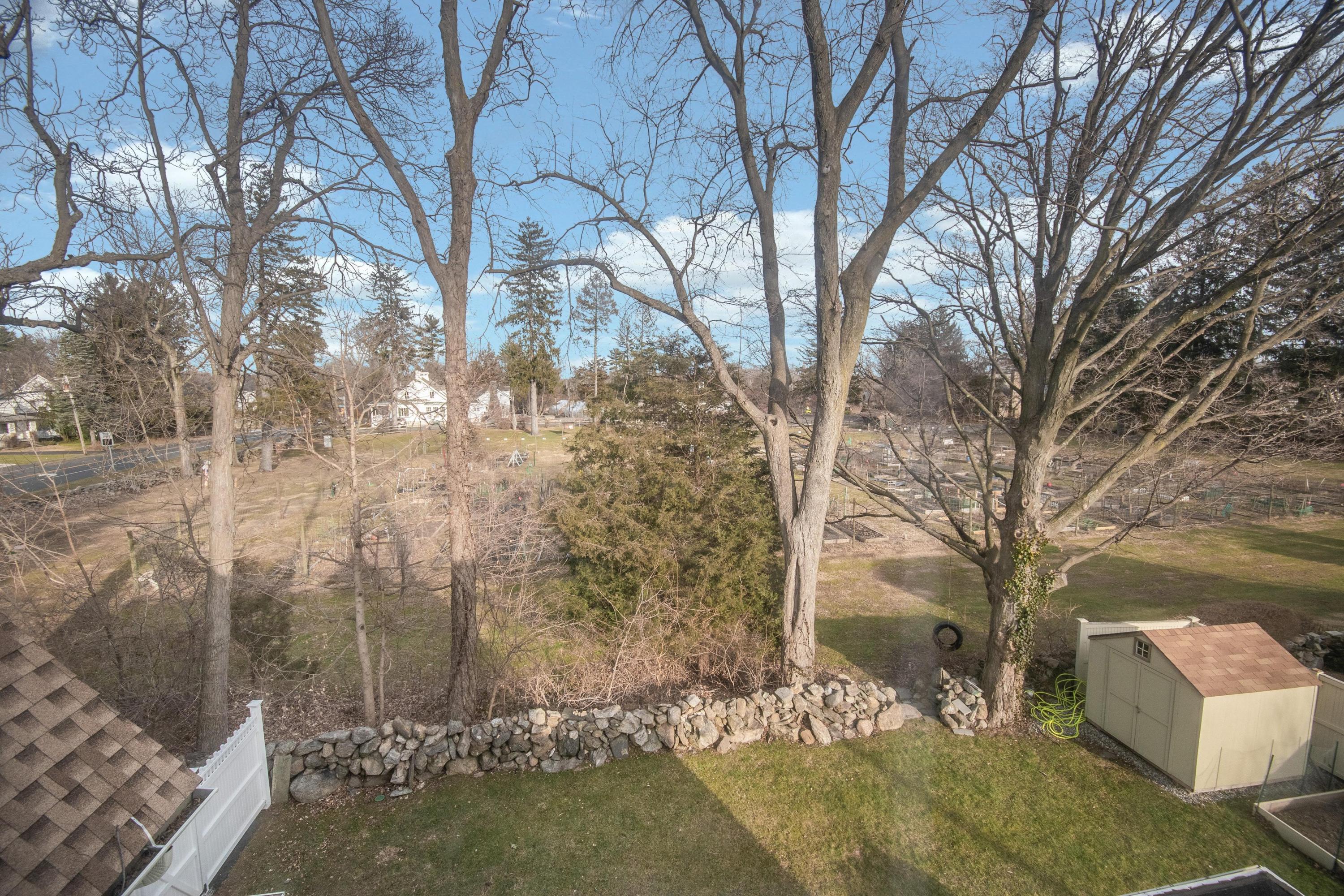338 Flax Hill Road Norwalk, CT 06854 - Photo 22 of 26 a view of a yard with large tree
