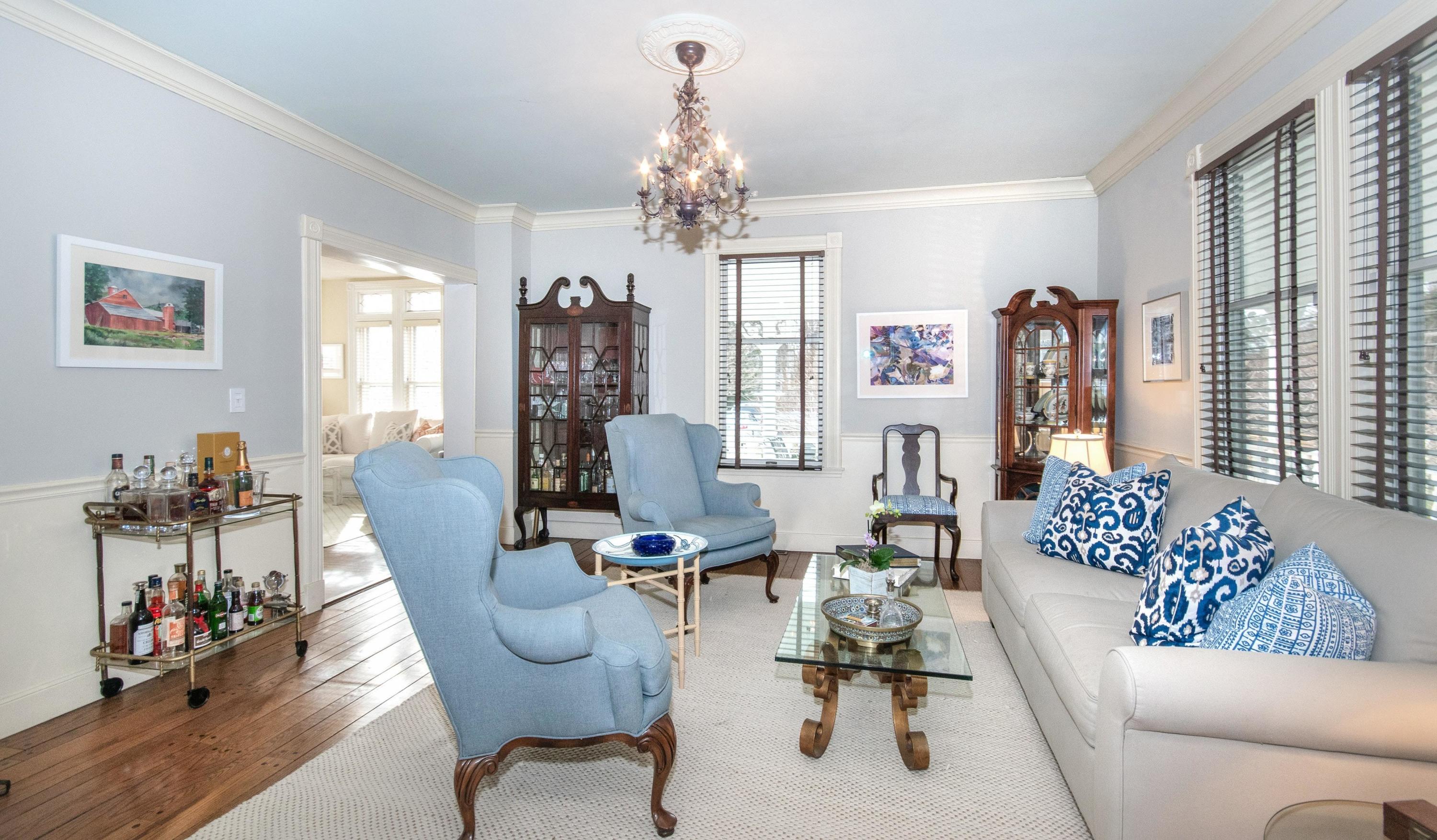 338 Flax Hill Road Norwalk, CT 06854 - Photo 5 of 26 a living room with furniture and a chandelier