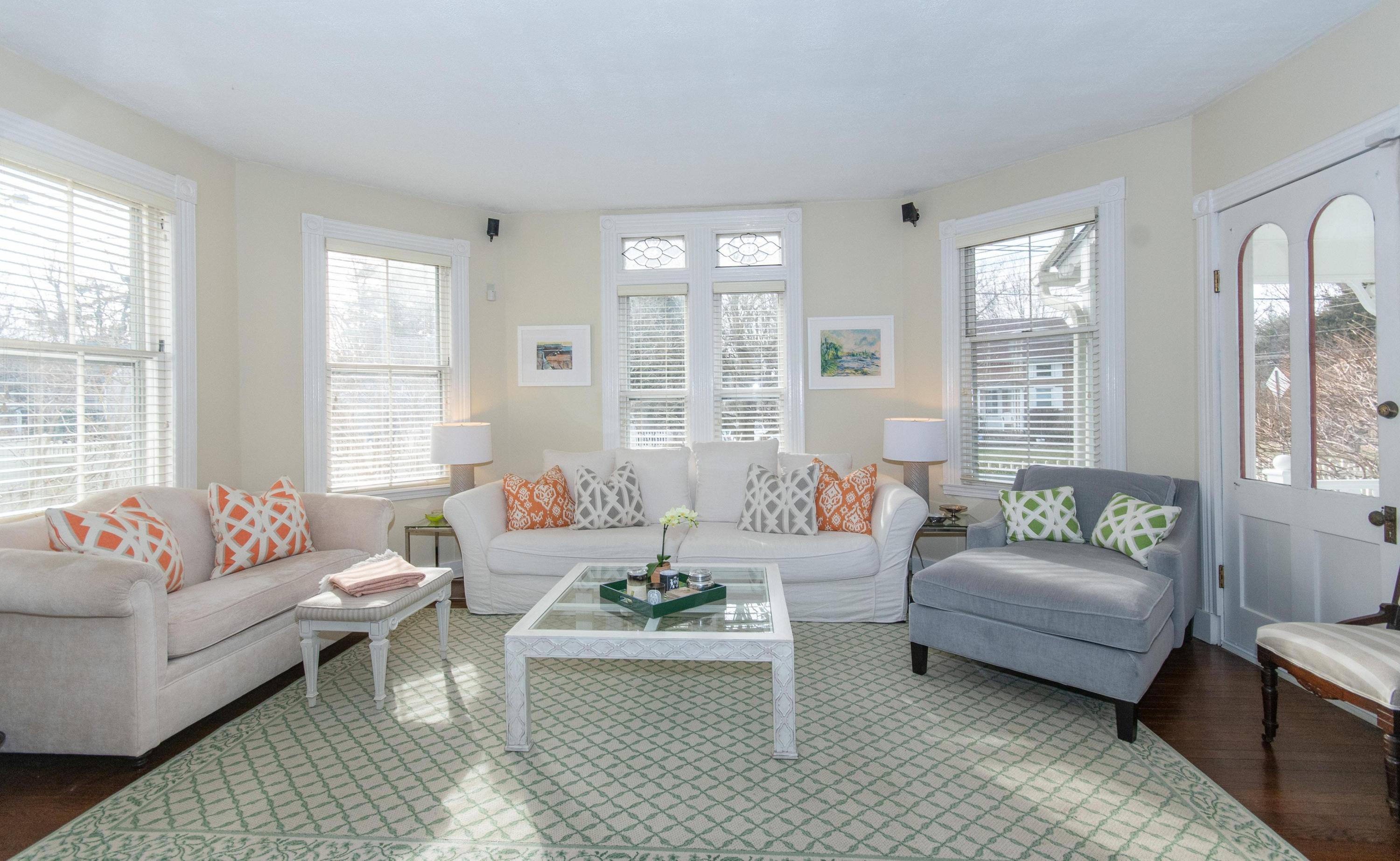 338 Flax Hill Road Norwalk, CT 06854 - Photo 7 of 26 a living room with furniture and windows