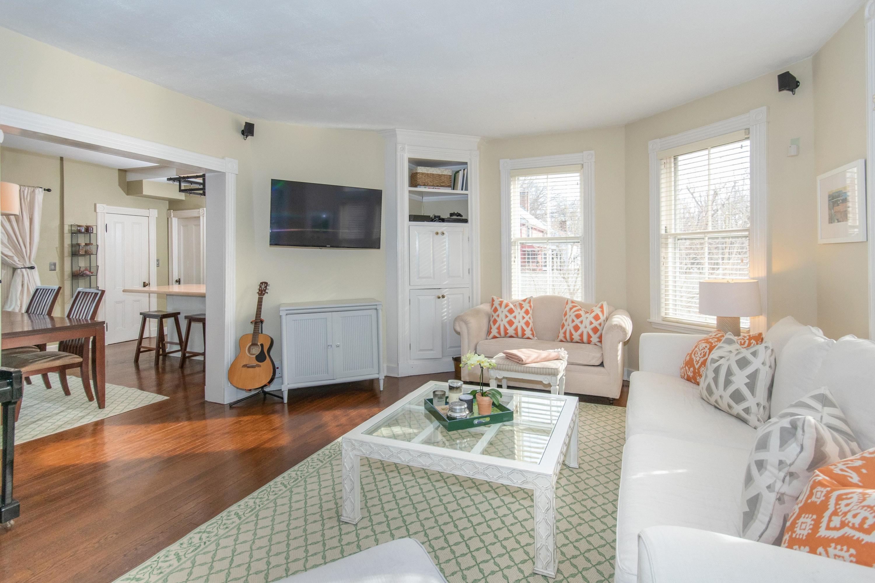 338 Flax Hill Road Norwalk, CT 06854 - Photo 8 of 26 a living room with furniture and a flat screen tv