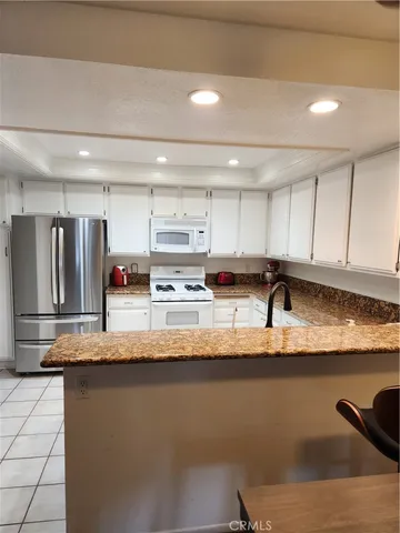 $355,000 | 4861 Lago Drive, Unit 206, Huntington Beach, CA 92649