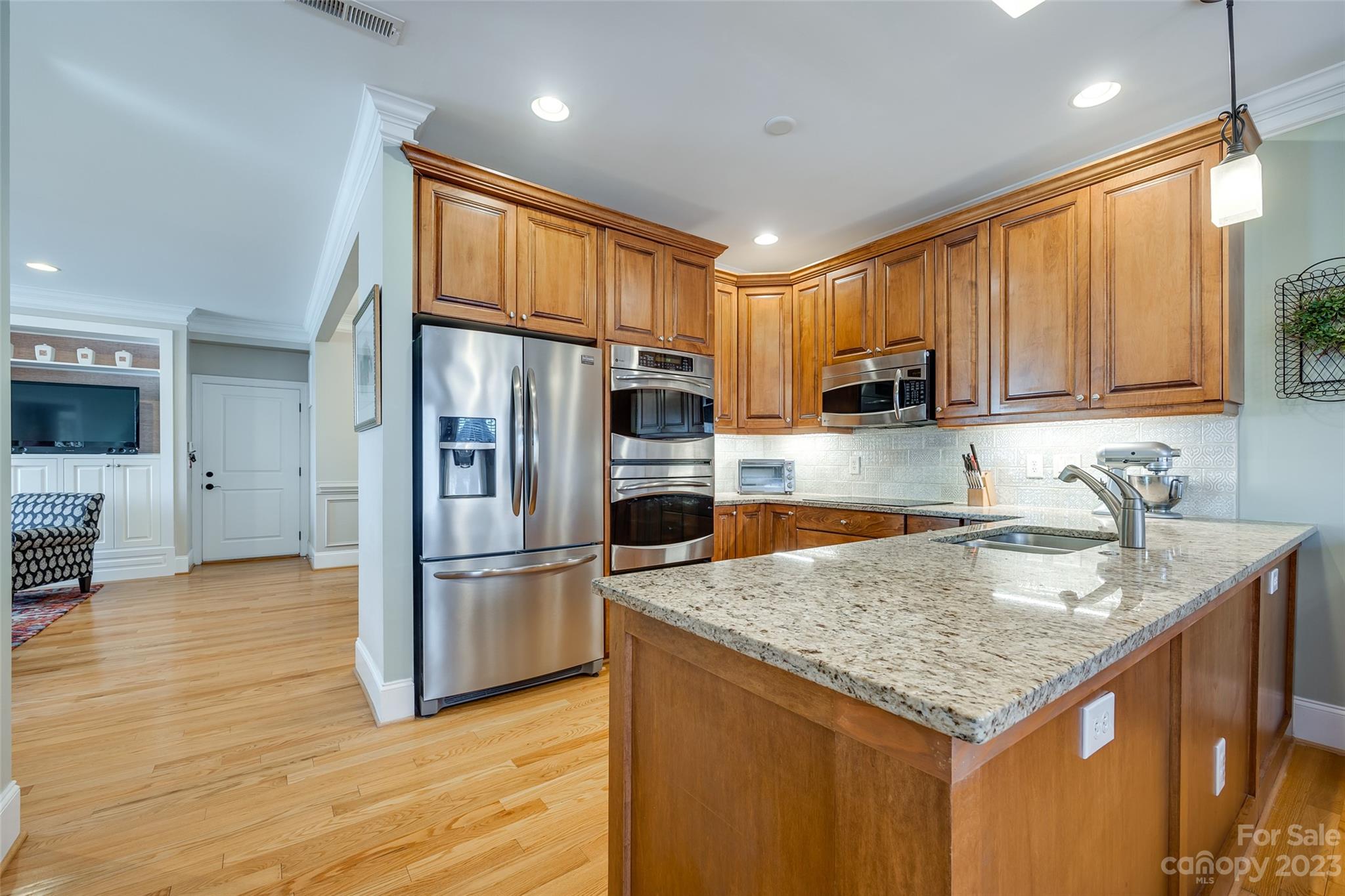 502 Whistling Straits Lane Fort Mill, SC 29708 - Photo 12 of 37 a kitchen with stainless steel appliances granite countertop a refrigerator a sink and a stove