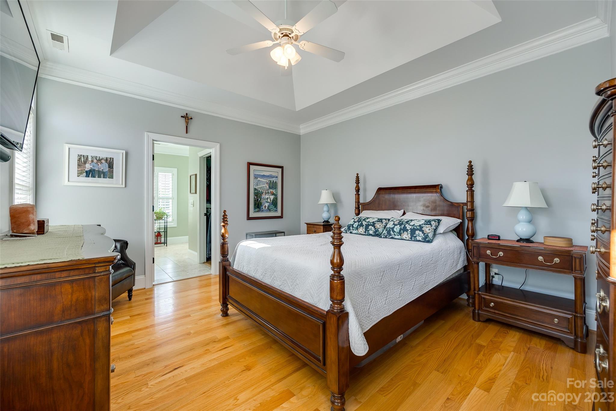 502 Whistling Straits Lane Fort Mill, SC 29708 - Photo 14 of 37 a bedroom with a bed and a chandelier