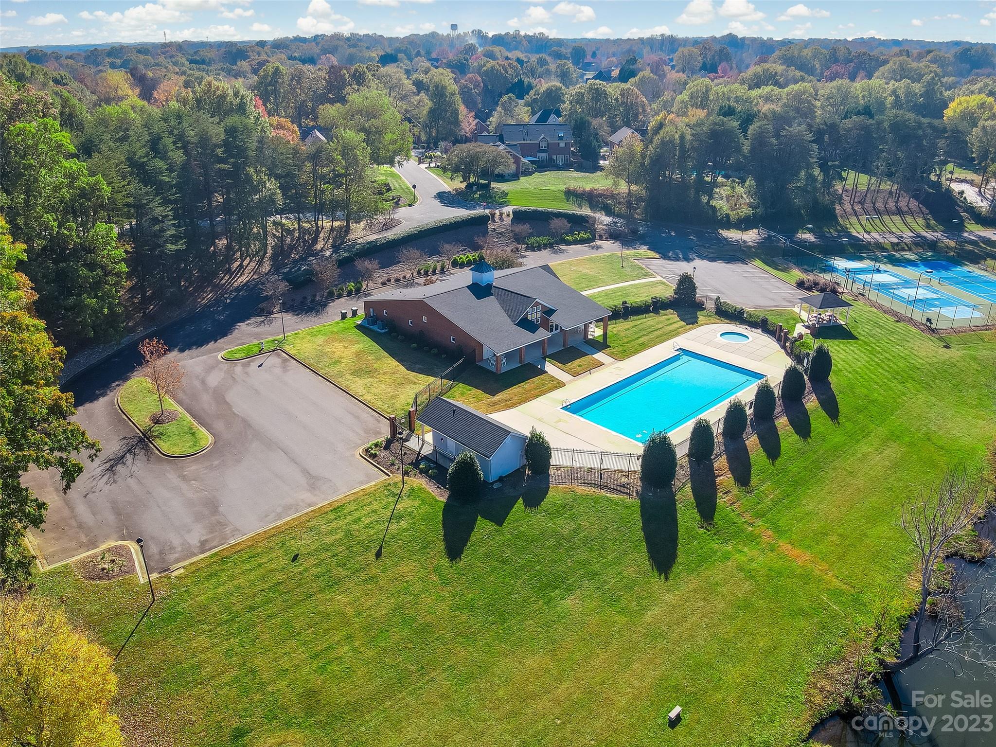 502 Whistling Straits Lane Fort Mill, SC 29708 - Photo 32 of 37 an aerial view of a swimming pool patio and mountain view
