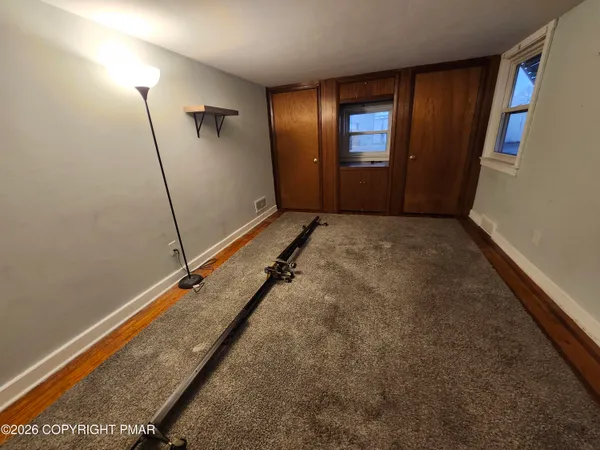 a view of an empty room with stairs