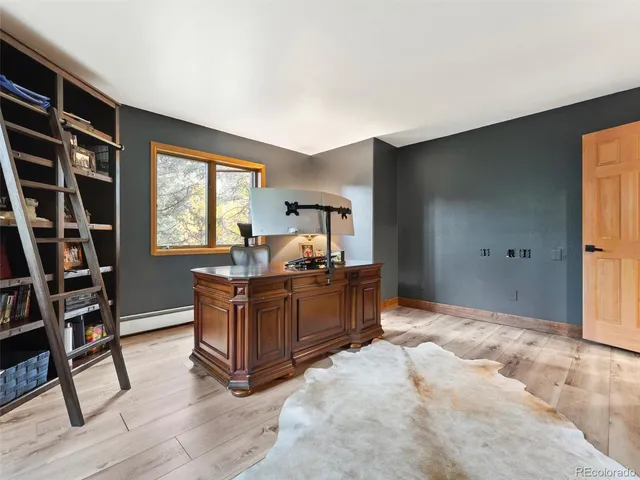 a bed room with furniture and a window
