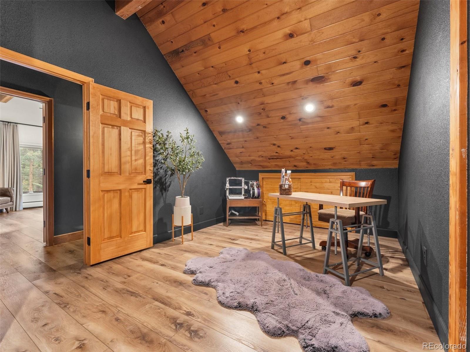 9459 South Turkey Creek Road Morrison, CO 80465 - Photo 16 of 25 a view of a porch with seating space